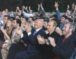 May 24 - RedSquare_Putin Moscow Mayor Luzhkov singer Andrei Makarevich applaud.jpg